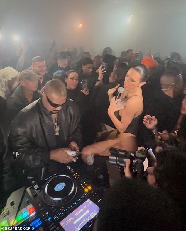 Bianca Censori was caught in an awkward moment after she tried desperately to get her husband's attention during a Grammy afterparty on Sunday night