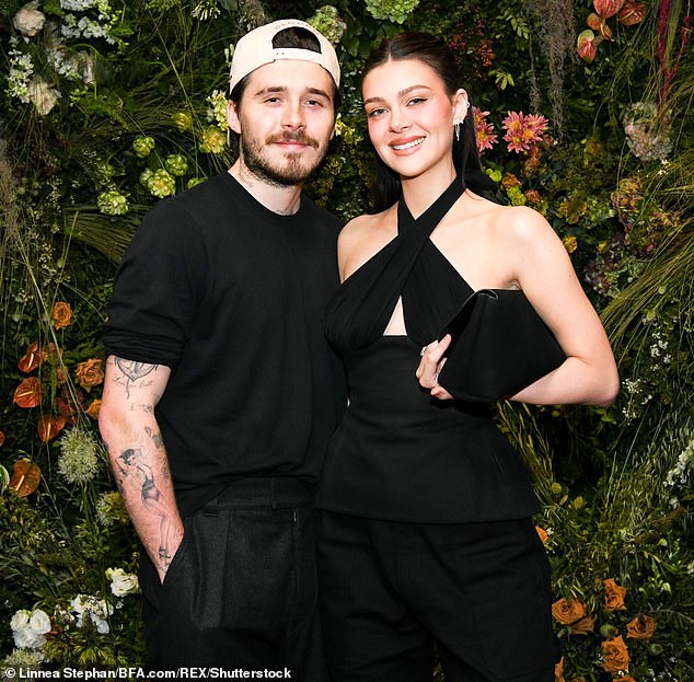 Sources close to the family are now waiting to see whether Brooklyn, who lives in Los Angeles with his wife American heiress Nicola Peltz, takes to Instagram to wish David a happy Father’s Day today (pictured last month)