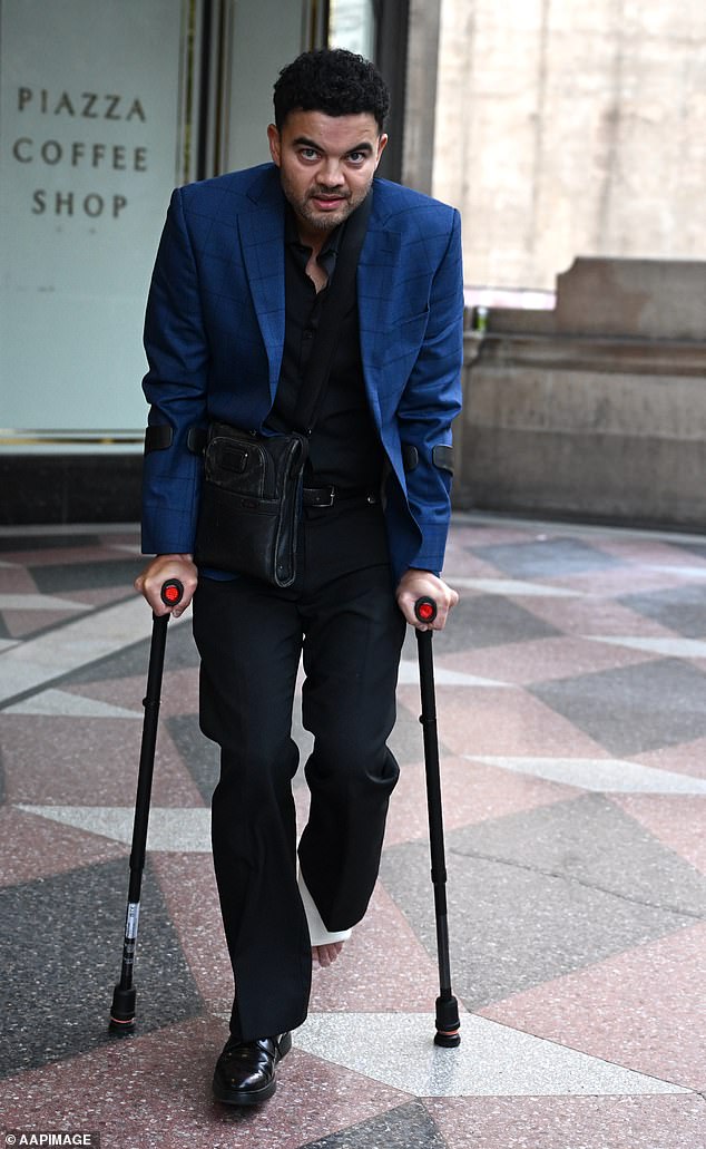 Guy Sebastian hobbled out of Sydney ’s Downing Centre District Court on a set of crutches on Tuesday, just weeks after suffering a serious leg injury