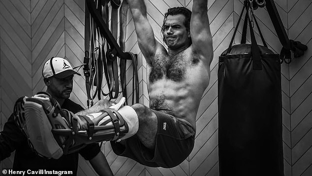 Henry Cavill showed off his famously rugged physique as he worked his way back to fitness on Wednesday after injuring his leg on the set of his new film