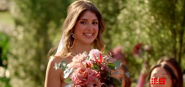 A Married At First Sight 2026 trailer has left viewers stunned after a bride was shown waiting alone at the altar with no sign of her groom. (Pictured: Sydney-based bride Mel Akbay)