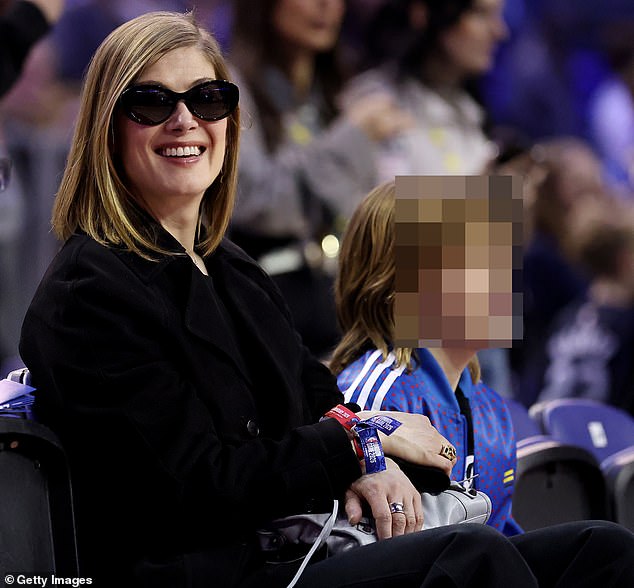 Rosamund Pike enjoyed a rare outing with youngest son Atom as they attended NBA's London Game 2026 which saw the Memphis Grizzlies take on Orlando Magic at the O2 on Sunday