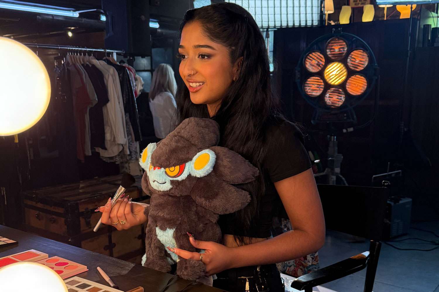 Maitreyi Ramakrishnan holds a plush of her favorite Pokémon, Luxray. Courtesy of The Pokemon Company International