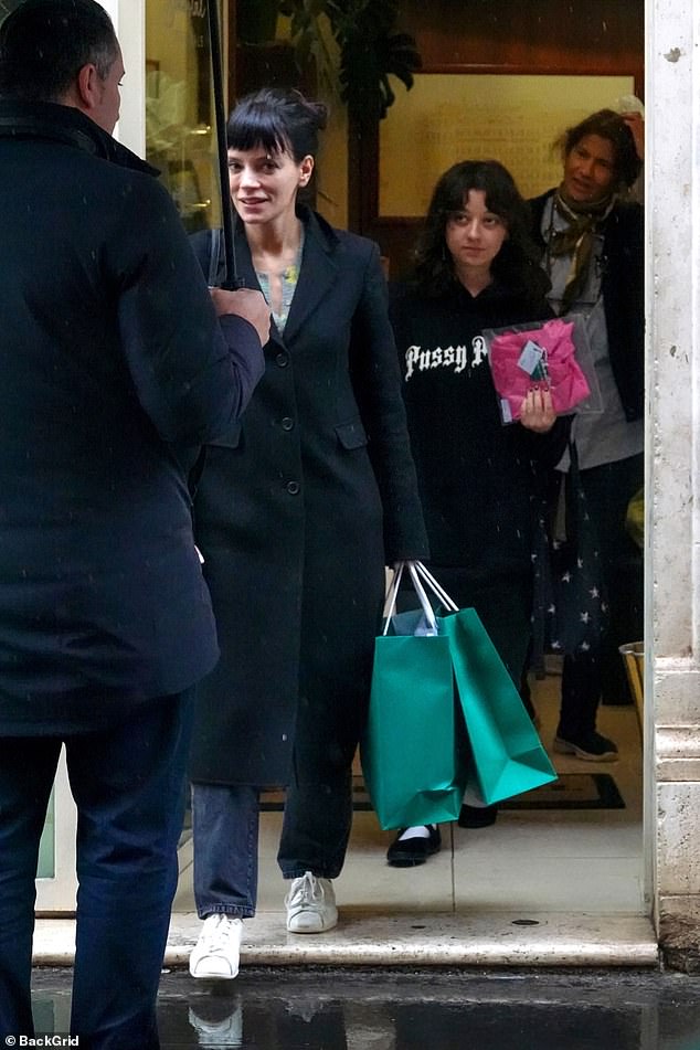 Lily Allen appeared in great spirits as she went on a designer shopping spree in Rome on Thursday, just months after revealing that she was in therapy to curb her spending addiction