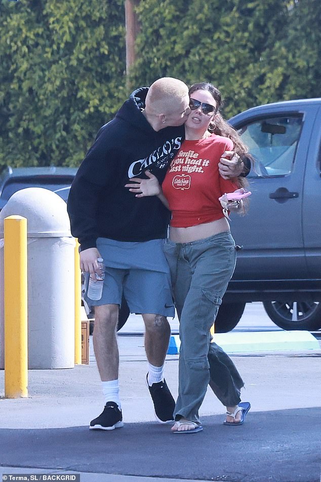 Australian rapper The Kid Laroi , 22, couldn't keep his hands off new girlfriend Sophie HM as they stepped out for a breakfast date in Los Angeles on Tuesday