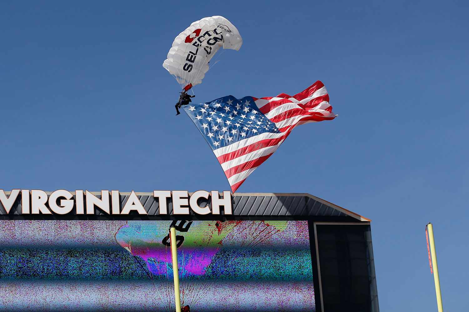 A parachuter crashes at Virginia Tech's Lane Stadium on April 18, 2026Credit: Lee Coleman/Icon Sportswire via Getty