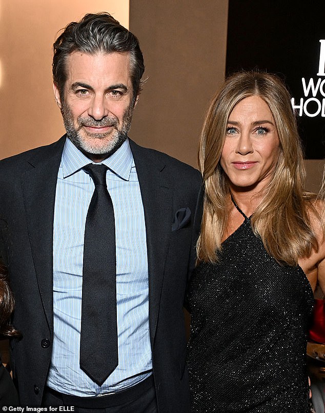 Jennifer Aniston is madly in love with her boyfriend Jim Curtis as they hit their one-year anniversary. Seen in November