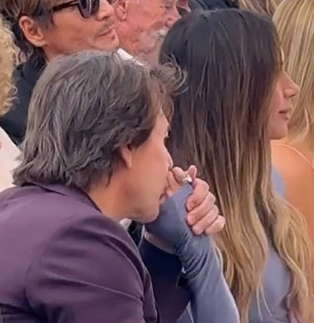 Victoria Beckham received a tender kiss from her long-time pal Tom Cruise while watching her husband David be honoured at Hollywood Walk Of Fame