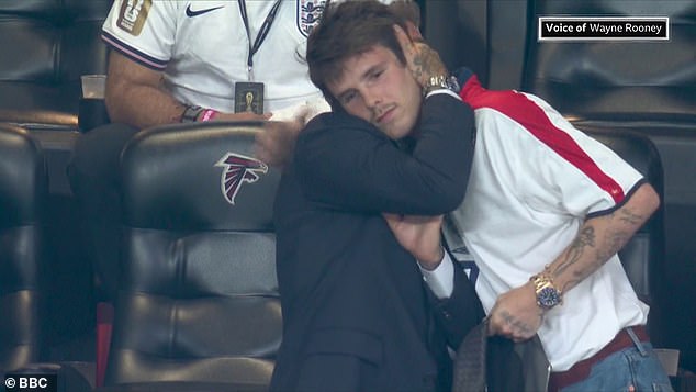Cruz Beckham was spotted giving his father a comforting hug as England crashed out of the World Cup on Wednesday following a 2-1 defeat to Argentina