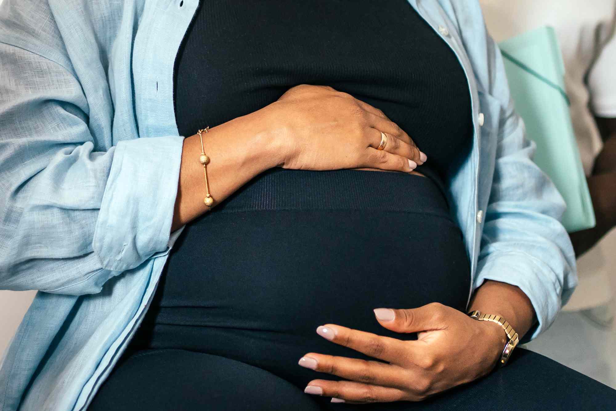 Woman holds pregnant belly (stock)Credit: Getty